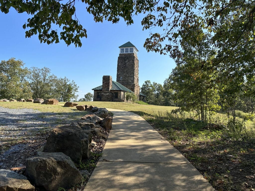 Stone CCC viewing tower atop Flagg Mountain, viewed from sidewalk at the bottom of tower.