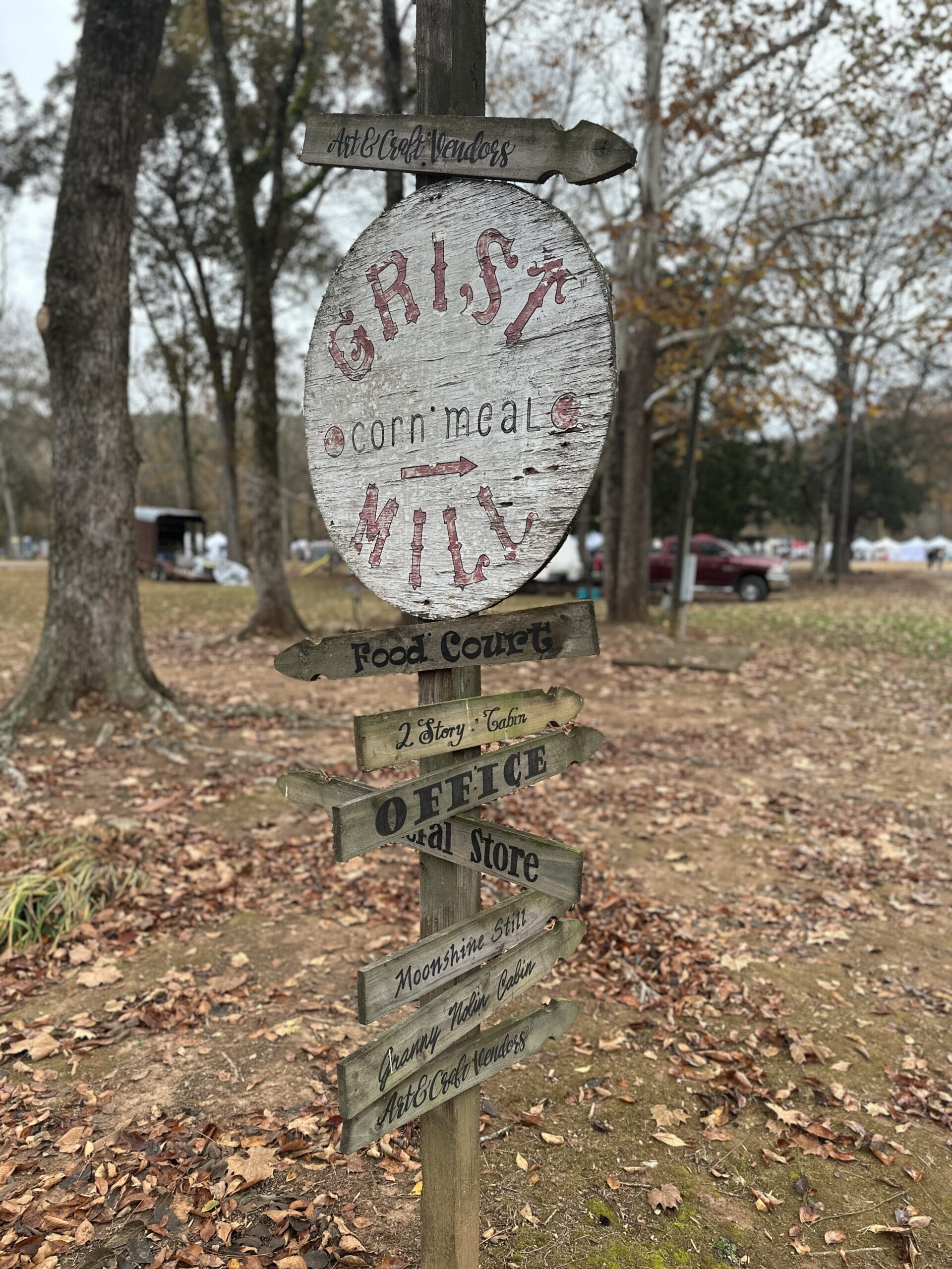 Old sign reading "Grist Mill" at Homestead Hollow in Springville, AL.