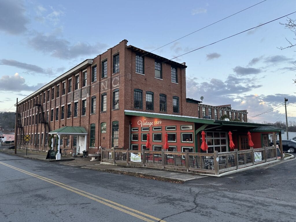 Exterior of large, historic textile mill in Fort Payne, AL.