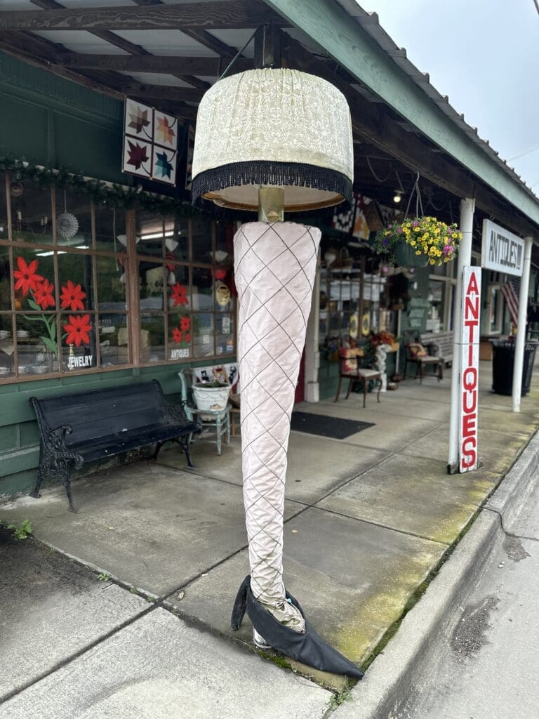 Porch support post decorated as the leg lamp from "A Christmas Story".
