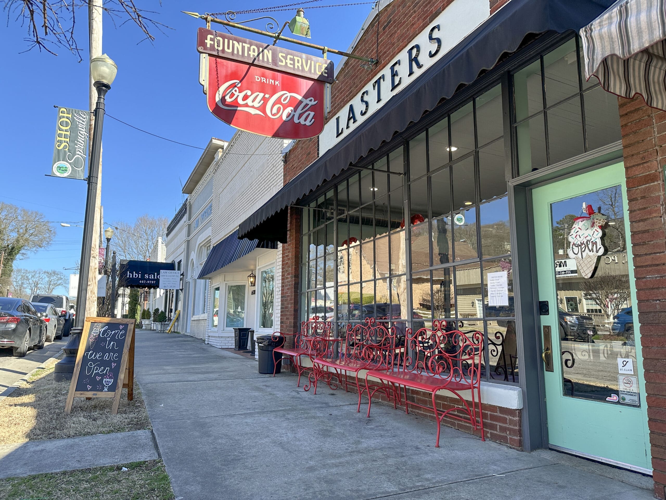 Sidewalk view of Lasters Soda Fountain in downtown Springville, AL.