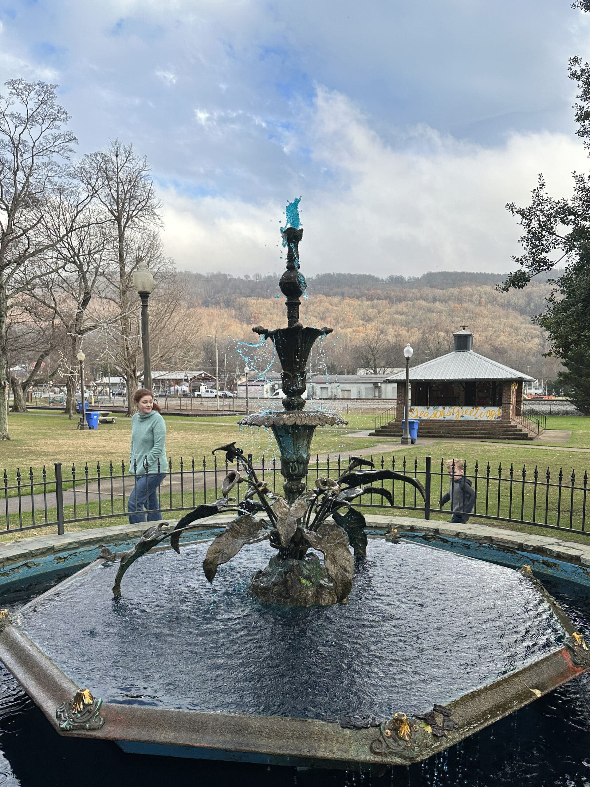 A large, ornate fountain spraying blue water.