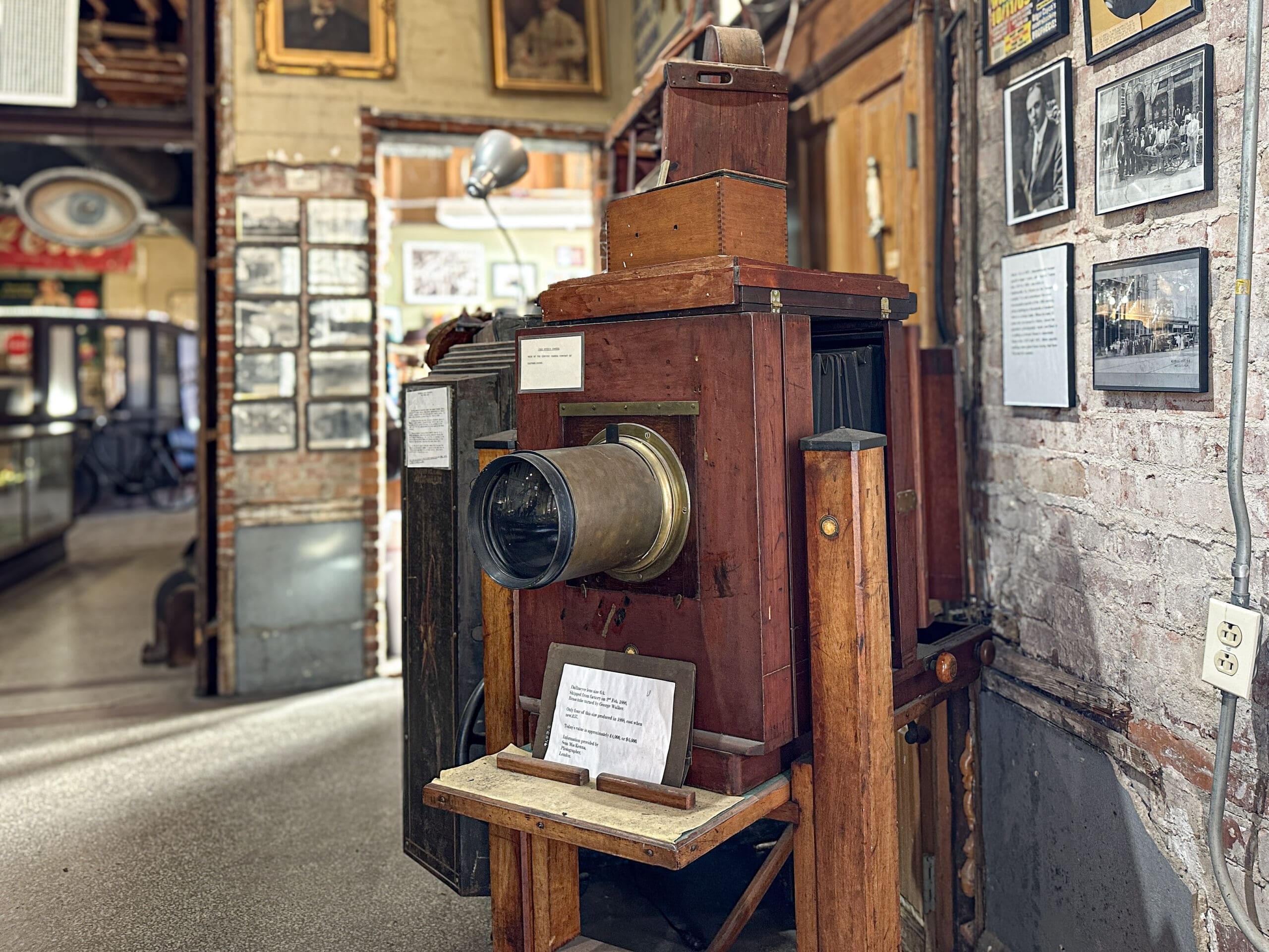 A large wooden-framed camera from the early 20th century.